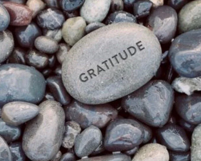 a stone with a word gratitude engraved